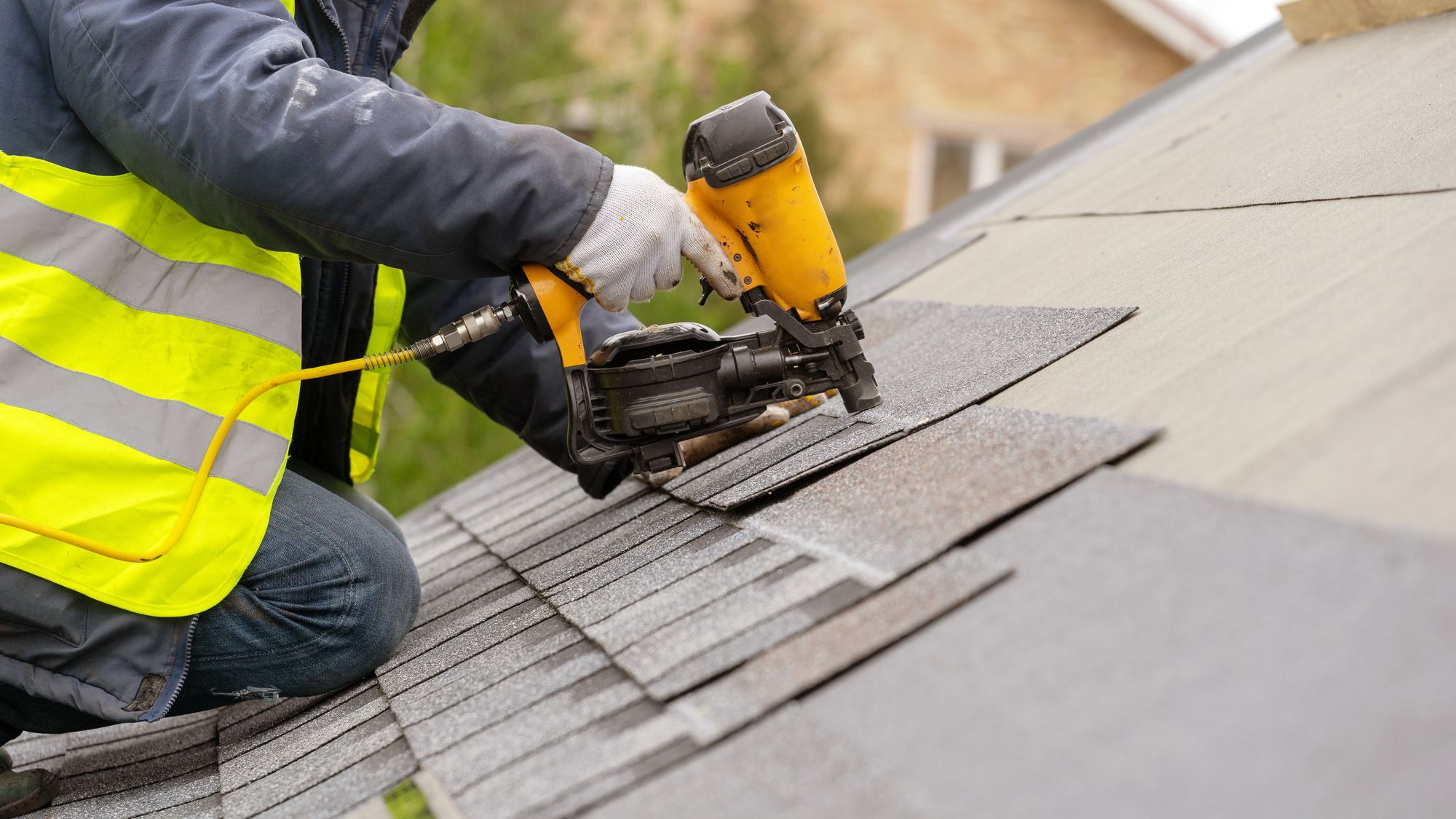 Worker Slating Roof Tiles